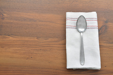 Image showing Old spoon on cloth