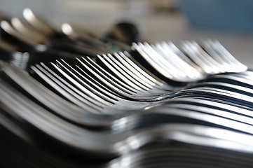 Image showing Forks on the kitchen counter.