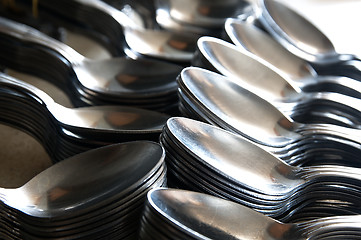 Image showing Teaspoon arranged symmetrically on the table.