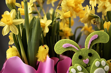 Image showing Easter bunny and yellow daffodils.