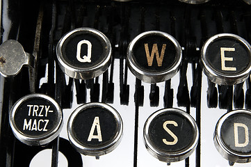 Image showing Old, dusty typewriter seen up close.