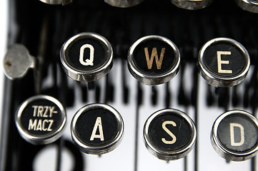 Image showing Old, dusty typewriter seen up close.
