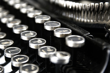 Image showing Old, dusty typewriter seen up close.