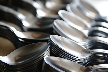 Image showing Teaspoon arranged symmetrically on the table.