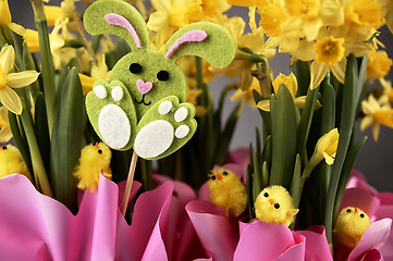 Image showing Easter bunny and yellow daffodils.