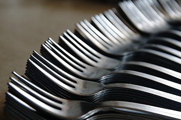 Image showing Forks on the kitchen counter.