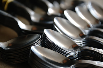 Image showing Teaspoon arranged symmetrically on the table.