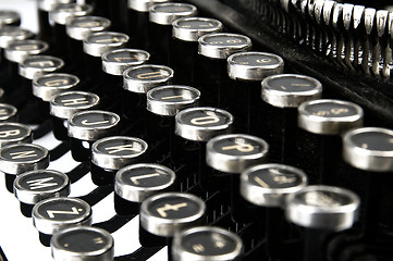 Image showing Old, dusty typewriter seen up close.