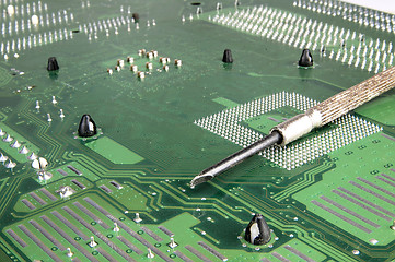 Image showing Computer motherboard and Screwdriver.