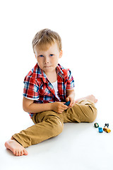 Image showing Funny blue-eyed three-year boy. Studio photo