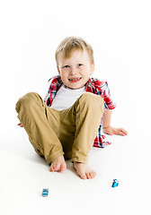 Image showing Funny blue-eyed three-year boy. Studio photo