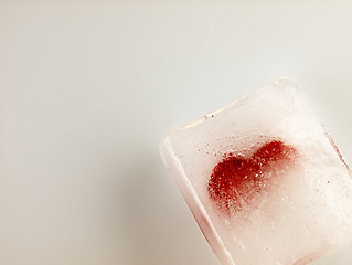 Image showing Red heart embedded in ice.