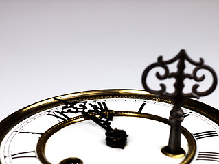 Image showing Old clock with roman numerals and key..