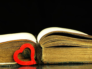 Image showing Heart and old, open book with a damaged cover.