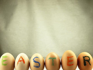 Image showing Easter written on eggs.