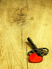 Image showing Old metal key and red heart.