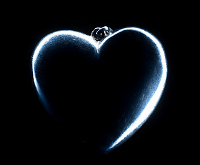 Image showing Heart shape emerging from a black background.