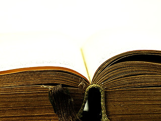 Image showing Old, open book with a damaged cover.