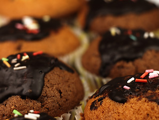 Image showing Muffins with chocolate icing.