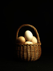 Image showing Easter eggs in a wicker basket.