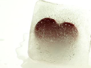 Image showing Red heart embedded in ice.