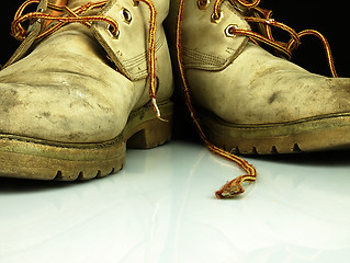 Image showing Pair of old, worn heavy boots.