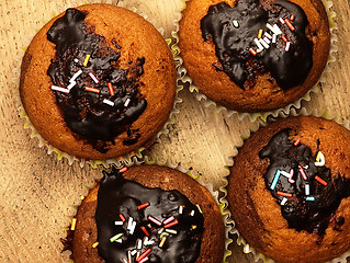 Image showing Muffins with chocolate icing.