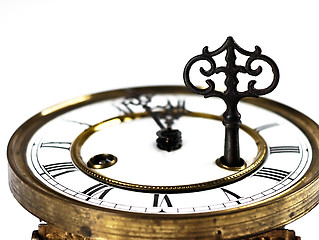 Image showing Old clock with roman numerals and key..