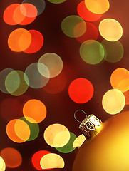 Image showing Golden Christmas Tree bauble and magic bokeh.