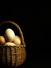 Image showing Easter eggs in a wicker basket.