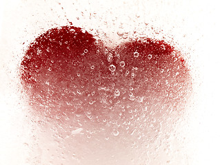 Image showing Red heart embedded in ice.