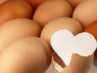 Image showing White heart comes from a broken egg.