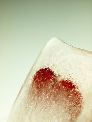 Image showing Red heart embedded in ice.