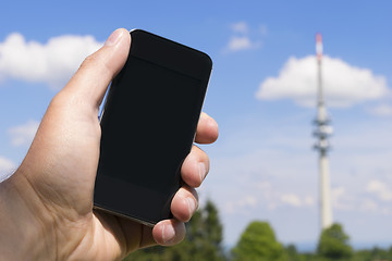 Image showing Mobile phone and transmission tower
