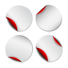 Image showing Set of white round promotional stickers with red backside.  