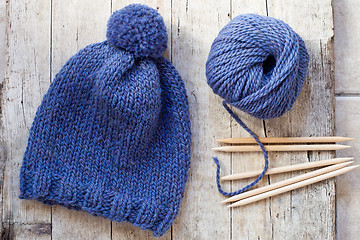 Image showing wool blue hat, knitting needles and yarn