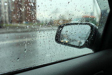 Image showing rain outside the window of the car