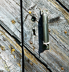 Image showing  cross lombardy    seprio a    rusty brass  door curch  closed i