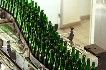 Image showing Many bottles on conveyor belt