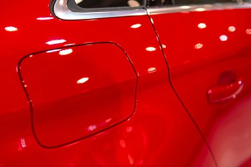 Image showing Petrol cap with cover on red car