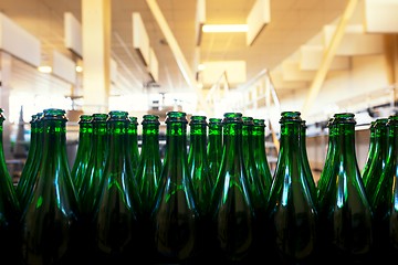 Image showing Many bottles on conveyor belt