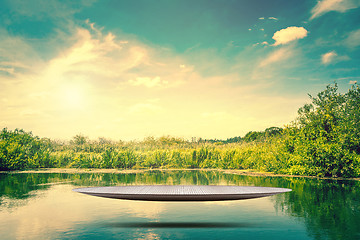 Image showing Metal stage hovering over a lake