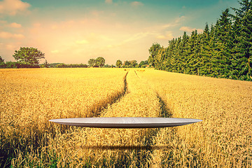 Image showing Stage hovering over a golden field