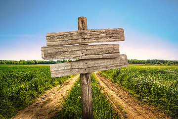 Image showing Wooden sign on a country road