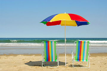 Image showing Beach chairs and umbrella