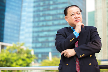 Image showing Senior Asian businessman in suit smiling portrait