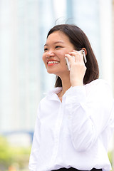 Image showing Young Asian female executive using smart phone