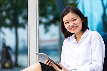 Image showing Young Asian female executive using tablet PC
