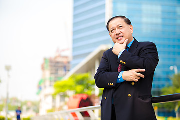 Image showing Senior Asian businessman in suit smiling portrait