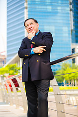 Image showing Senior Asian businessman in suit smiling portrait